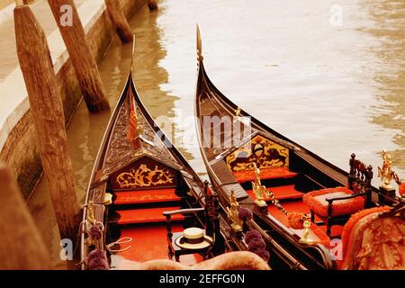 High angle view of two gondolas moored in a canal, Venice, Veneto, Italy Stock Photo