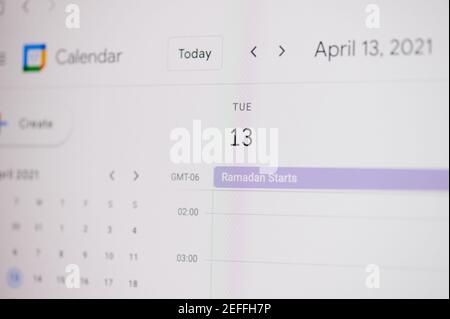 New york, USA - February 17, 2021: Ramadan start 13 of April on google calendar on laptop screen close up view. Stock Photo