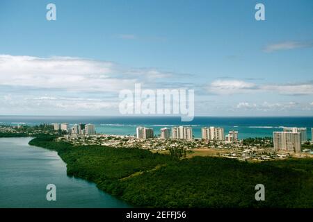 High angle view of a coastal city with lush vegetation, San Juan, Puerto Rico Stock Photo