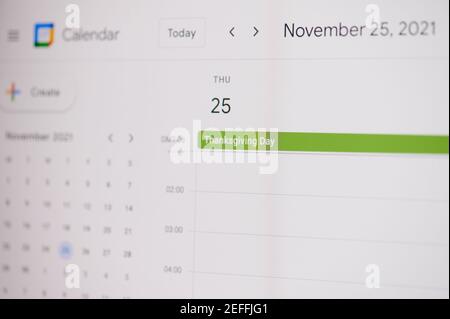 New york, USA - February 17, 2021: Thanksgiving day 25 of november on google calendar on laptop screen close up view. Stock Photo