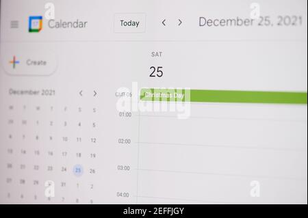 New york, USA - February 17, 2021: 31 Christmas Day 25 of December on google calendar on laptop screen close up view. Stock Photo