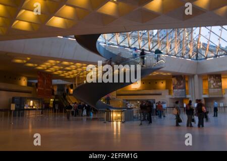 Tourists in an art museum, Louvre Pyramid, Musee Du Louvre, Paris, France Stock Photo