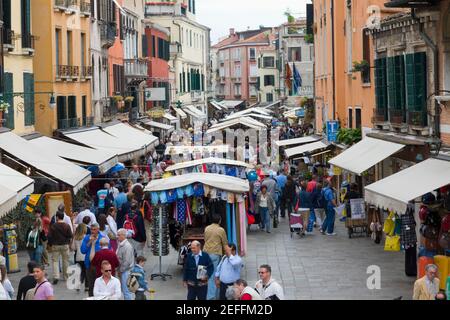 Tourists in a street market, Venice, Italy Stock Photo