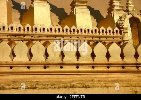 Wall of a Buddhist temple, That Luang, Vientiane, Laos Stock Photo