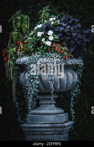Decorative flower urns in a formal park Stock Photo