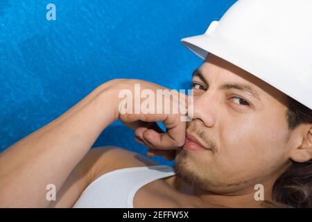 Portrait of a male construction worker thinking Stock Photo