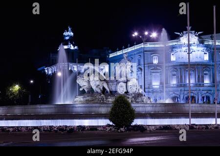 Fountain in front of a palace lit up at night, Cibeles Fountain, Palacio de Linares, Plaza de Cibeles, Madrid, Spain Stock Photo