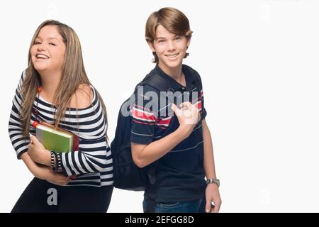 Portrait of a young woman with a teenage boy smiling Stock Photo