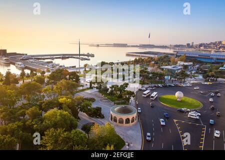 Azerbaijan, Baku, View of traffic at roundabout on Neftchilar Ave, looking towards Baku bay, Venezia restaurant, the Carpet museum, in the distance is Stock Photo