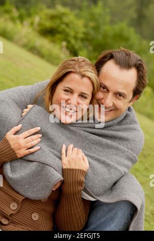 Portrait of a mature man embracing a mid adult woman from behind Stock ...