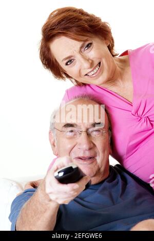 Portrait of a senior couple watching television Stock Photo