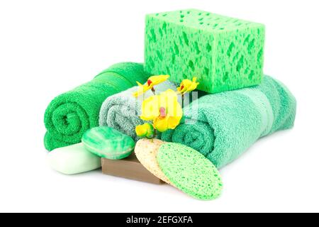 Spa set with towels, soaps, sponges and orchid flowers isolated on white background. Stock Photo