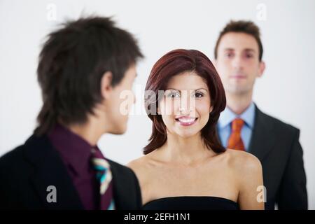 Three business executives standing in a row Stock Photo