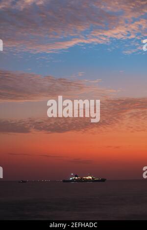 Colorful sunset view from Galle Dutch fort evening, sailboat in the horizon, after sundown blue hour, long exposure photography. Stock Photo