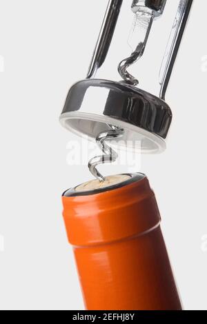 Close up of a bottle with a corkscrew Stock Photo