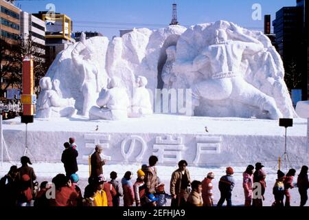 Tourist walking in front of snow sculptures, Snow Festival, Sapporo, Japan Stock Photo