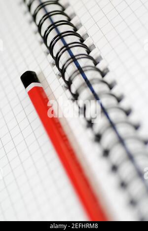 Close-up of a pencil on an open spiral book Stock Photo