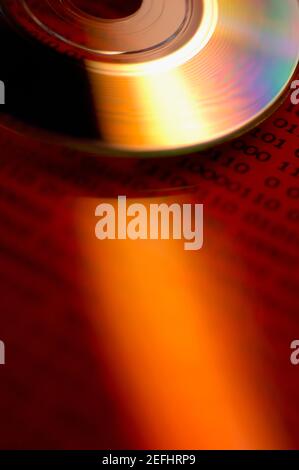 Close-up of a CD on binary code Stock Photo