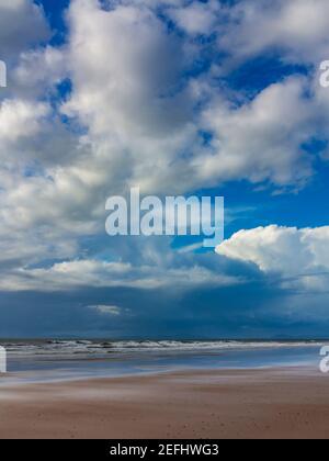 The sandy beach at Morfa Dyffryn between Barmouth and Harlech in Gwynedd on the north west coast of Wales with stormy sky above. Stock Photo