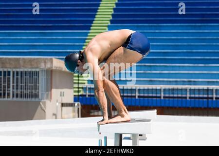 This is an image of a young man diving into the water Stock Photo - Alamy