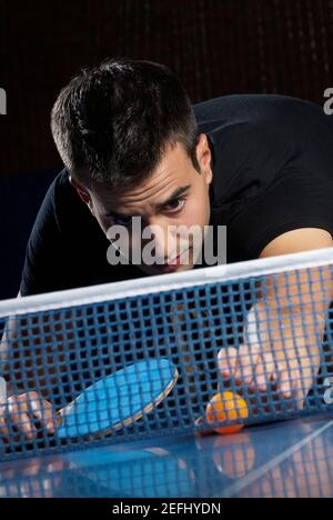 Young man playing table tennis Stock Photo