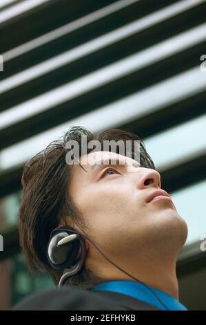 Low angle view of a businessman wearing headphones Stock Photo