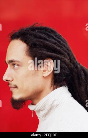 Side profile of a young man with dreadlocks Stock Photo