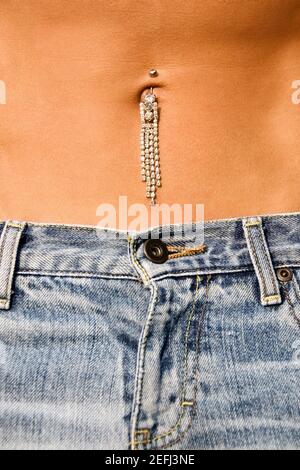 Mid section view of pierced navel of a gay man Stock Photo
