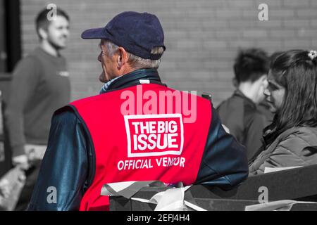 The Big Issue official vendor at Bournemouth, Dorset UK in October Stock Photo