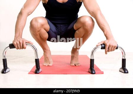 Close-up of a person holding exercising equipment Stock Photo