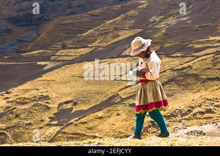 Side profile of a girl walking on a hill, Peru Stock Photo