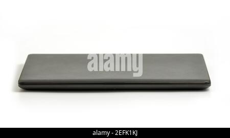 Closed Laptop isolated on white background - front view with clipping path Stock Photo