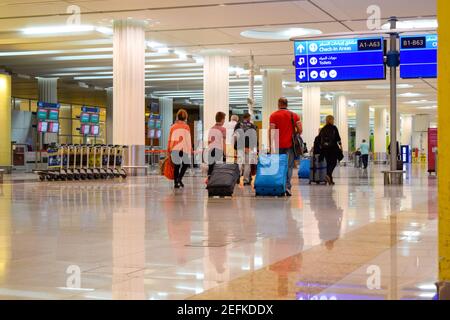 Passengers inside Dubai International Airport terminal 3 Stock Photo