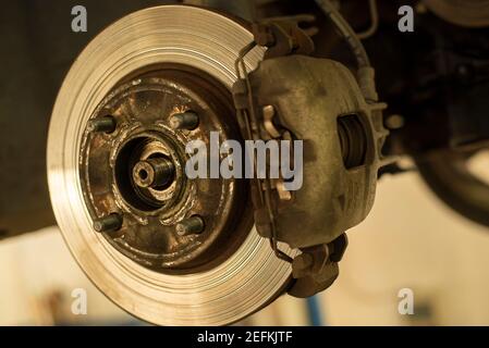 Detail of a worn disc brake ready for replacement and maintenance Stock Photo