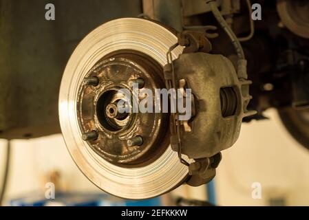 Detail of a worn disc brake ready for replacement and maintenance Stock Photo