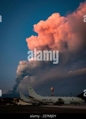 Sigonella, Italy. 16th Feb, 2021. Europes most active volcano Mt. Etna, spews a cloud of ash see from the flight line at U.S. Naval Base Sigonella February 16, 2021 in Sigonella, Sicily, Italy. Etna is the highest and most active volcano in Europe. Credit: Planetpix/Alamy Live News Stock Photo