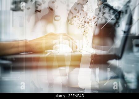 Close-up on the hands of a woman typing on a laptop keyboard. Double exposure effects Stock Photo