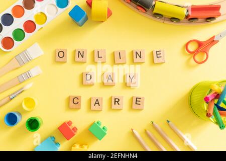 Online day care cover concept - toys and supplies with isolated tablet Stock Photo