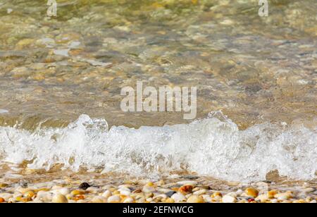 Detail image of water rolling in on a bay side beach is Sag Harbor, NY Stock Photo