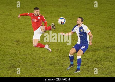 Barnsley's Conor Chaplin (left) and Blackburn Rovers' Lewis Travis battle for the ball during the Sky Bet Championship match at Oakwell, Barnsley. Picture date: Wednesday February 17, 2021. Stock Photo