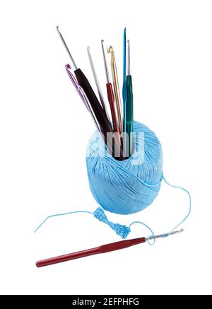 Premium Photo  Hook crochet set. ball of yarn with different sizes of  crochet hooks isolated on white background.