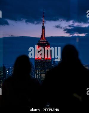 The Empire State Building is illuminated in red to celebrate the upcoming landing of the NASA Perseverance rover on the surface of Mars February 16, 2021 in New York City. Perseverance will search for signs of ancient microbial life. Credit: Planetpix/Alamy Live News