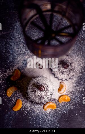 chocolate muffins sprinkled with goodies with cherries and chocolate and cocoa Stock Photo