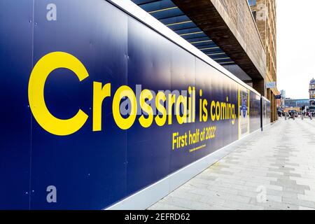 Crossrail is coming, first half of 2022 sign at the entrace of new Elizabth line, Woolwich, London, UK Stock Photo