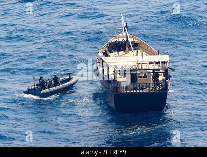 US Navy A boarding team from the Arleigh Burke-class guided missile ...