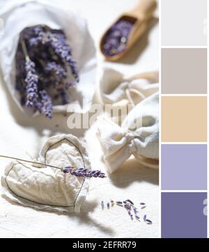 Color matching palette from Close-up on dry lavender flowers in white tracing paper. Hand made lavender sachets on cotton tablecloth,. Wooden scoop