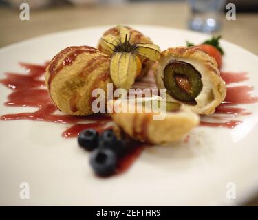 Hungarian Toasted Bread Crumb and Cinnamon Sugar Coated Dumplings Filled With Italian Plums Stock Photo