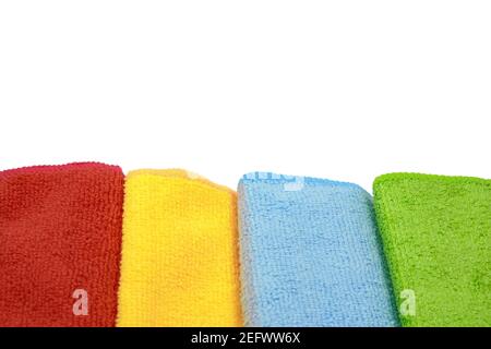 Stack of color microfiber cloths isolated on white. Row of Colorful microfiber towels. Stock Photo