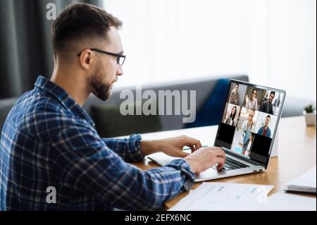 Video call, online business meeting, briefing. Successful caucasian freelancer communicate with business colleagues about economic trends and strategy via video conference. Distant work Stock Photo