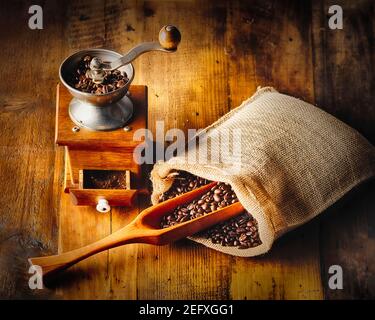 Close up View of an Antique Coffee Grinder and Whole Beans Coffee Stock Photo